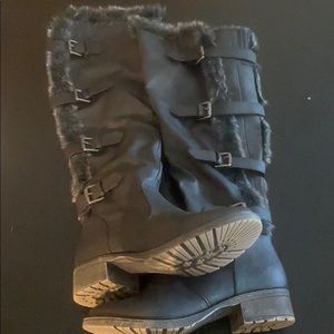 Heeled, knee high black boots with buckles